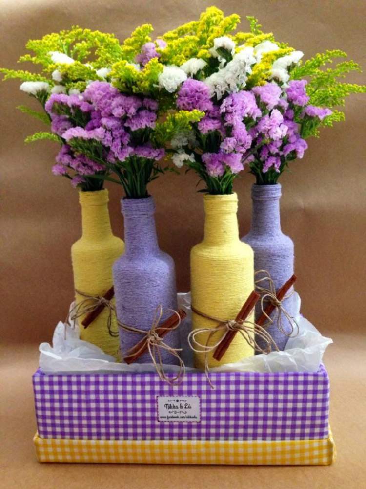vasos para plantas e flores feitos de garrafas encapadas com barbante